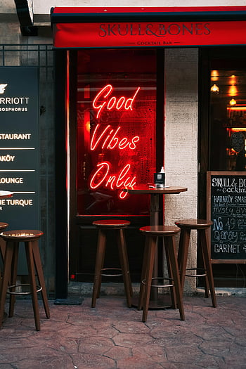 neon light, storefront window, chic bar, neon-lit bar, bar entrance, stools, nightlife scenes, cocktail bar, good vibes only, skull and bones, neon sign