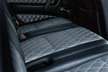 black and gray car seat, quilted leather interior, luxury car, elegant design, high-quality image, car interior, quilted seats, leather seats, car seats, luxury vehicle, elegant car interior