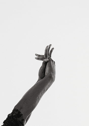 hands gesture, artistic close-up, black and white photography, minimalist background, hand locks, expression of unity, symbolic gesture, white background, visual artistry.