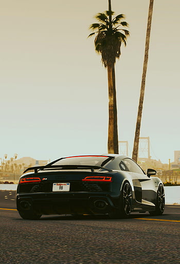 Black Audi R8, coastal road, palm trees, sunset, automotive luxury, sleek Audi coupe, driving scene, sunset drive, luxury sports car, coastal drive, sunset road trip