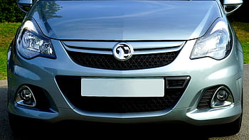 gray car front, sleek silver sedan, modern design, chrome details, close-up, car grille, headlights, front bumper, automotive design, car exterior, silver car