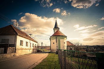 village scene, church, houses, warm sunset, sky, white and brown concrete house, idyllic, rural, architecture, countryside, evening light