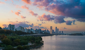 drone shot, Han River, Seoul skyline, vibrant sunset, cityscape view, urban landscape, sunset photography, river view, city panorama, sunset scene, aerial photography