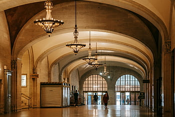 old building interior, classic chandeliers, spacious corridor, majestic arched corridor, historic building interior, arched ceilings, interior design, vintage lighting, architectural details, grand hallway, chandelier lighting