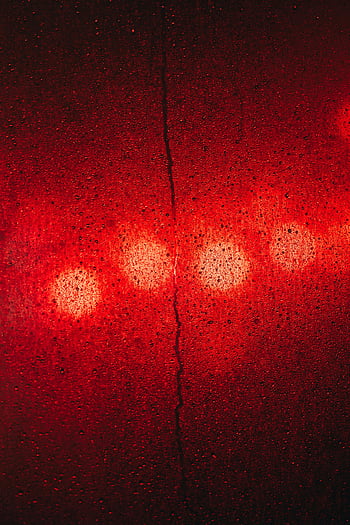 abstract red light, wet surface, light reflections, vibrant visual effect, textured surface, abstract image, red light, wet texture, abstract photography, red reflections, wet background