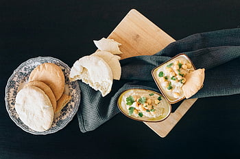 hummus, pita bread, wooden board, top view, creamy hummus, delicious food, flatbread, chickpea dip, appetizer, Mediterranean cuisine, healthy snack