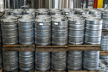 steel kegs, cylinder silver keg, industrial brewery, warehouse storage, stacked pallets, beer kegs, metal kegs, brewery equipment, keg lot, industrial kegs, brewery warehouse