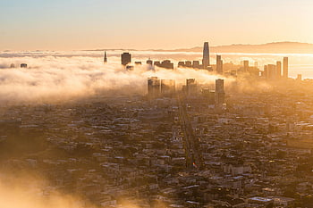San Francisco skyline, foggy cityscape, sunrise aerial view, iconic skyscrapers, urban landscape, morning mist, city in fog, sunrise city, San Francisco at sunrise, foggy urban scene, cityscape photography