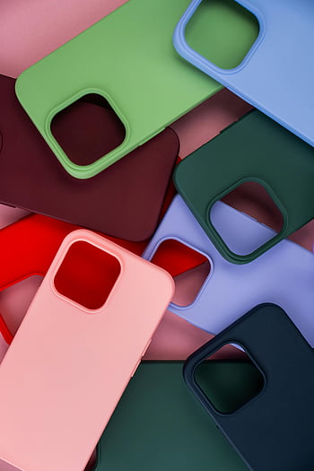 colorful phone cases, vibrant collection, abstract design, pink background, phone case variety, multicolored cases, phone accessories, trendy phone cases, stylish cases, phone cover options, phone case assortment