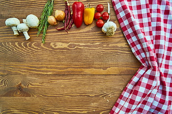 assorted spices, brown wooden table, red and white textile, fresh vegetables, rustic wooden table, checkered cloth, garlic, bell peppers, mushrooms, onions, rosemary
