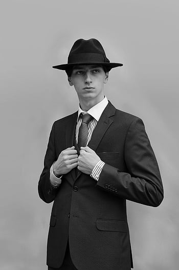 black suit jacket, black hat, formal wear, classic portrait, black and white, elegance, sophistication, man in suit, man in hat, formal portrait, black suit