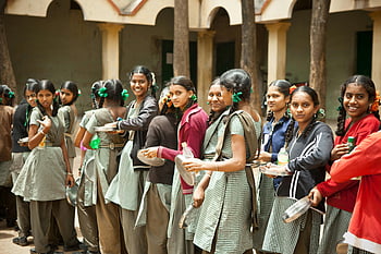 schoolgirls, braids, outdoor, lunchtime, school, smiling, daytime, group, uniform, plates, bottles