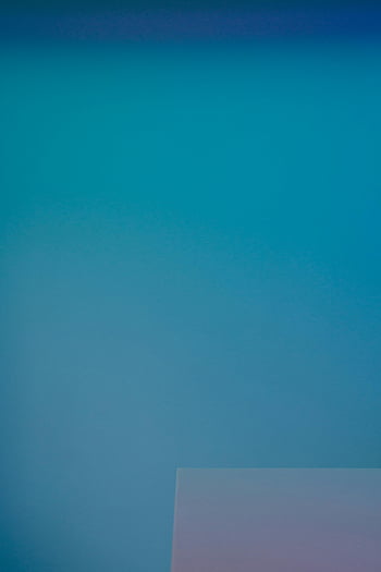 blue background, minimalist image, smooth blue gradient, subtle geometric shape, abstract art, modern design, color gradient, simple design, contemporary art, blue color, geometric art