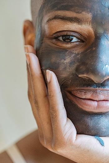 cosmetic mask, skincare, beauty, rejuvenating mud mask, close-up, smiling woman, facial treatment, skincare routine, beauty treatment, facial care, hand on face