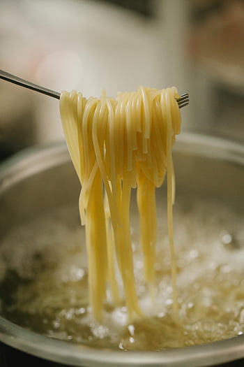 pasta cooking, boiling water, spaghetti, fork, close-up, cooking process, pan, boiling pasta, food preparation, kitchen, meal preparation