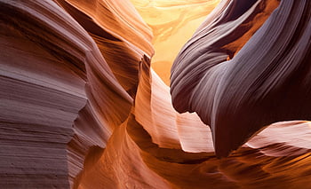 Antelope Canyon, Arizona, slot canyon, sandstone formations, natural wonder, desert landscape, unique geology, vibrant colors, smooth rock, light beams, Navajo land
