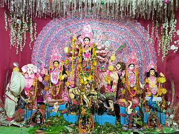 Hindu Deity Figurines, Goddess Durga, Indian Hindu festival, colorful display, altar, deities, celebration, festival decoration, religious figures, cultural celebration, traditional art