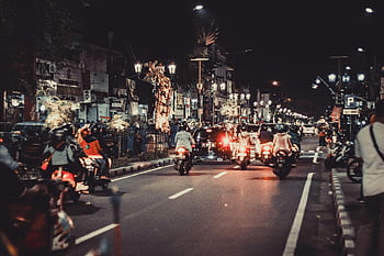 night street, motorcycles, urban life, vibrant lights, downtown energy, cars, motorbikes, lively night, city nightlife, street scene, night traffic