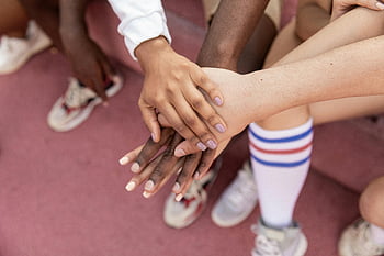 faceless multiracial sport team, stacking hands, sports court, teamwork, unity, friends, multiracial group, sports unity, court stacking, multiracial friends, sports teamwork