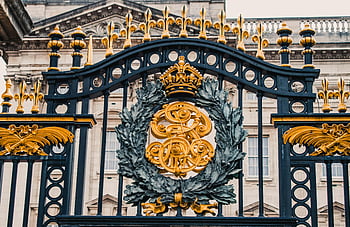 Buckingham Palace, ornate gate, gold and black iron, London, detailed view, royal emblem, palace entrance, British monarchy, historic architecture, royal residence, decorative gate