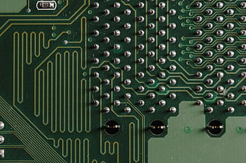 close-up shot, chip, electronic circuit board, intricate green patterns, components, detailed close-up, circuitry, microelectronics, technology, hardware, electronics