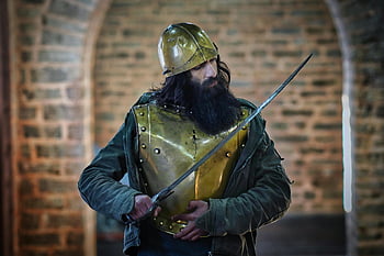 medieval knight, bronze helmet, sword, protective armor, historic stone setting, medieval armor, knight in armor, historic setting, medieval warrior, stone archway, medieval sword