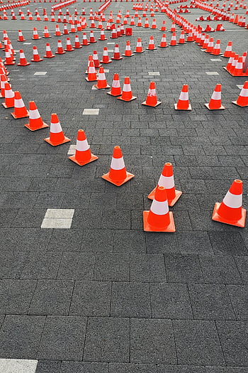 traffic cones, aerial view, paved surface, complex pattern, orange cones, safety cones, road cones, cone arrangement, cone pattern, traffic safety, construction cones