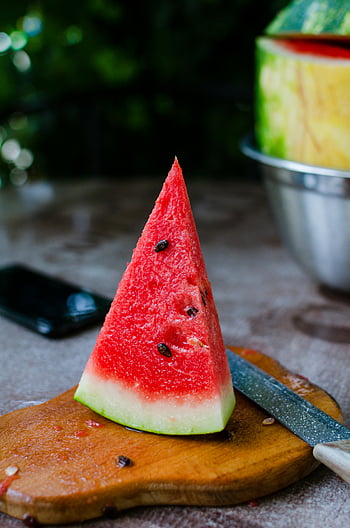 sliced watermelon, brown wooden chopping board, juicy watermelon slice, red watermelon, seeds, wooden board, outdoors, summer fruit, fresh watermelon, watermelon slice, knife
