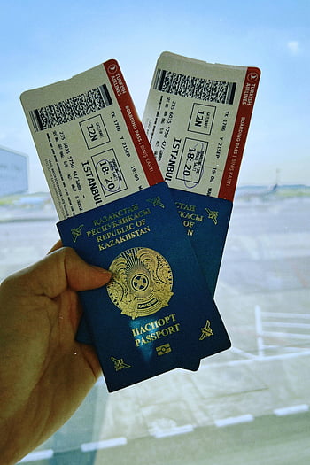 Kazakhstan passport, airline tickets, airport, Warsaw Poland, boarding pass, Turkish Airlines, travel documents, international travel, passport holder, flight tickets, travel planning