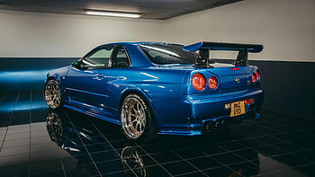 เส้นขอบฟ้านิสสันสีน้ำเงิน, นิสสันสกายไลน์ gtr, โรงรถในร่มเงา, ภาพไดนามิก, รถสีน้ำเงิน, ที่จอดรถในร่ม, รถประสิทธิภาพสูง, รถสปอร์ต, ยานพาหนะหรูหรา, ผู้ที่ชื่นชอบรถ, การจัดแสดงโรงรถ