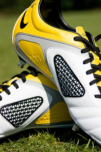 soccer cleats, white-yellow-and-gray, high-quality image, yellow and white shoes, black laces, grass, sports footwear, athletic shoes, soccer footwear, outdoor sports, cleats