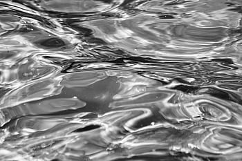 grayscale photo, water surface, monochrome abstract, ripples on water, fluid texture, dynamic visual, abstract ripples, water ripples, grayscale water, abstract water, monochrome water