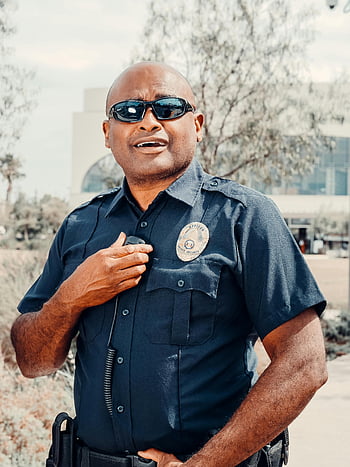 policeman, black sunglasses, police officer, uniform, outdoors, public safety, confident pose, badge, security, law enforcement, uniformed officer