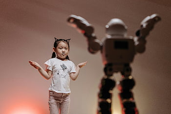 robot imitating girl, child interacting robot, futuristic robot, playful setting, modern technology, girl movement, robot technology, child robot interaction, playful interaction, modern robotics, child and robot