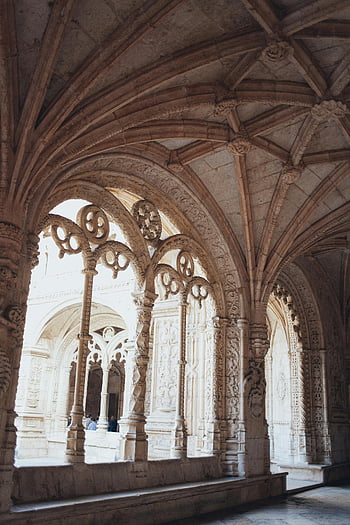 historical building, Gothic arches, stone carvings, historic monastery, interior architecture, medieval design, religious structure, ancient construction, ornate details, cultural heritage, architectural history