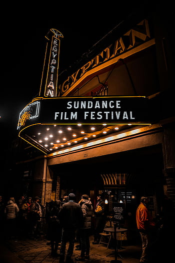 Egyptian Theater, Sundance Film Festival, night time, crowds, illuminated theater, film festival, outdoor gathering, night scene, people walking, street scene, winter attire
