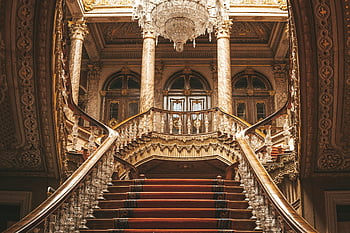 Dolmabahçe Palace, baroque staircase, Istanbul, ornate chandelier, intricate design, luxury interior, historical architecture, grand staircase, Turkish palace, opulent decor, chandelier lighting