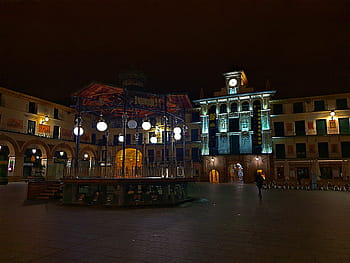 Tudela, Navarra, Spain, Plaza de los Fueros, night scene, illuminated buildings, clock tower, street lamps, arches, people walking, town square
