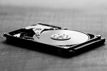 black and white hard drive, open hard drive, internal components, artistic shot, black and white photography, hard disk drive, computer hardware, storage device, technology, monochrome, close-up