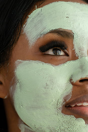 black woman, clay mask, green clay, facial mask, eye detail, close-up portrait, skincare, beauty treatment, natural beauty, facial care, woman's eye