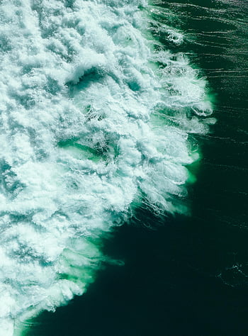 aerial view, ocean waves, crashing waves, rich textures, vibrant colors, dynamic capture, ocean photography, aerial photography, ocean surface, wave patterns, ocean textures