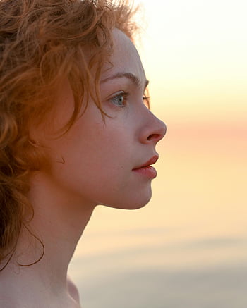 profile view, young redhead woman, sunset, curly red hair, profile portrait, young woman, sunset backdrop, red hair, profile shot, sunset photo, young female