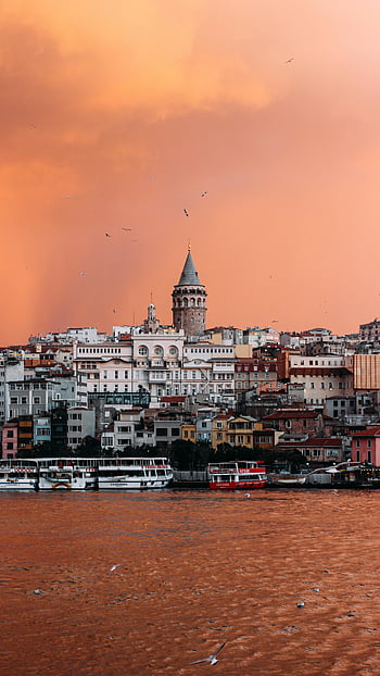 Istanbul skyline, Galata Tower, vibrant sunset, picturesque view, Istanbul Turkey, sunset photography, cityscape photography, historical architecture, waterfront scene, travel photography, urban landscape