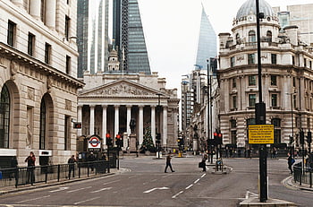 London street, pedestrian lane, high-rise buildings, historical architecture, bustling pedestrians, vibrant street, urban scene, city life, modern architecture, classic buildings, cityscape