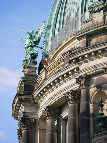 Berlin Cathedral, low angle view, intricate architecture, sculptures, building exterior, detailed facade, historical building, architectural details, Berlin landmark, green statues, blue sky
