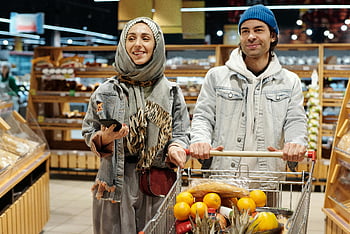 couple shopping, grocery shopping, supermarket, shopping cart, groceries, cheerful couple, supermarket aisle, fresh produce, shopping together, casual shopping, winter shopping