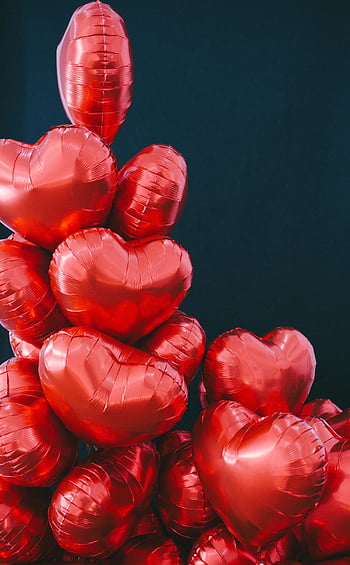 red heart shaped balloons, Valentine's Day, heart balloons, red balloons, vertical stack, celebration, festive, romantic, love, decoration, heart-shaped
