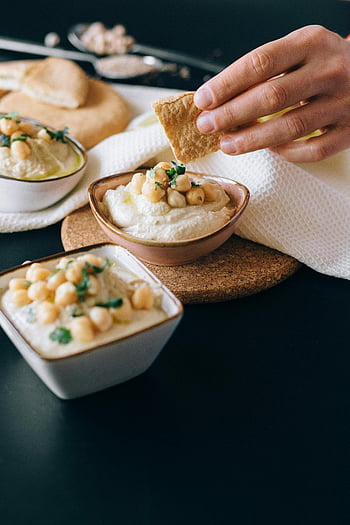 hummus, pita bread, dipping bread, chickpeas, close-up, garnished hummus, food photography, healthy eating, appetizer, Mediterranean cuisine, dip
