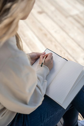 woman writing, notebook, pen, indoor, capturing thoughts, writing in notebook, woman indoors, writing activity, focused writing, personal journaling, creative writing