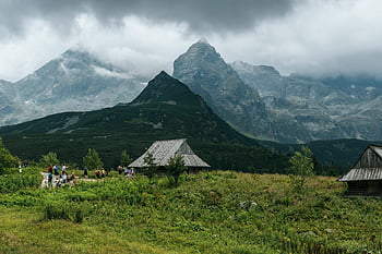 Tatra Mountains, Zakopane, Poland, wooden cabins, cloudy sky, grass field, majestic view, mountain landscape, outdoor scenery, natural beauty, hiking trails